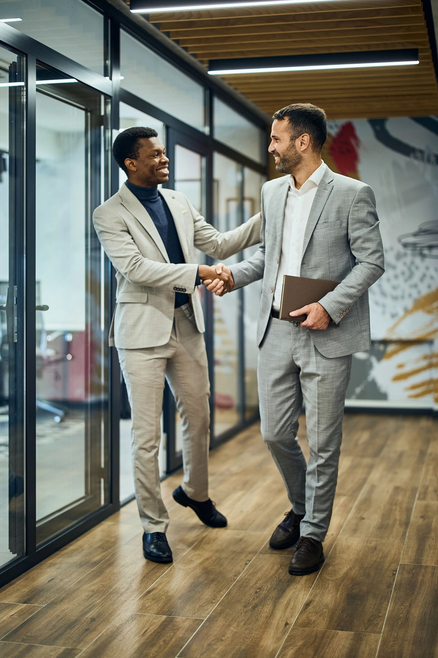 Businessmen handshake in office